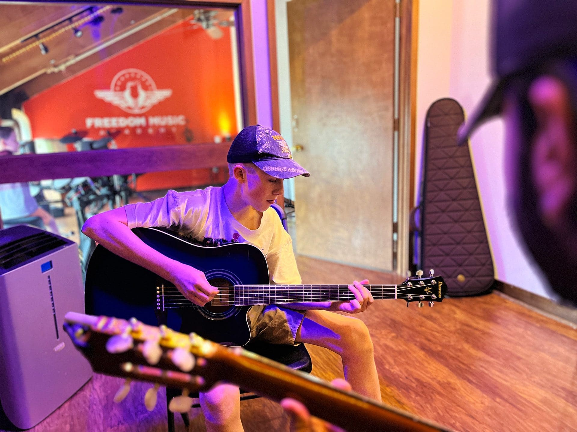 Guitar Lessons at Freedom Music Academy - Johnson City Tennessee c Student taking piano lessons from experienced teacher in Johnson City