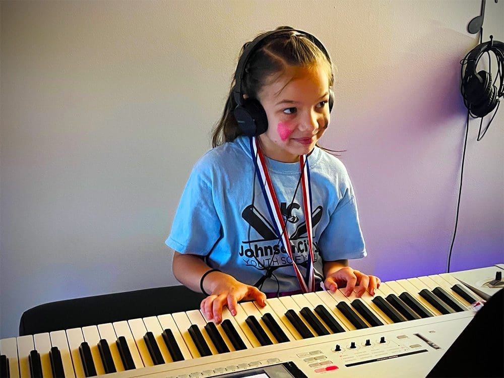 Piano Lessons for Kids near me at Freedom Music Academy in Johnson City Girl taking beginner piano lessons at Freedom Music Academy in Johnson City