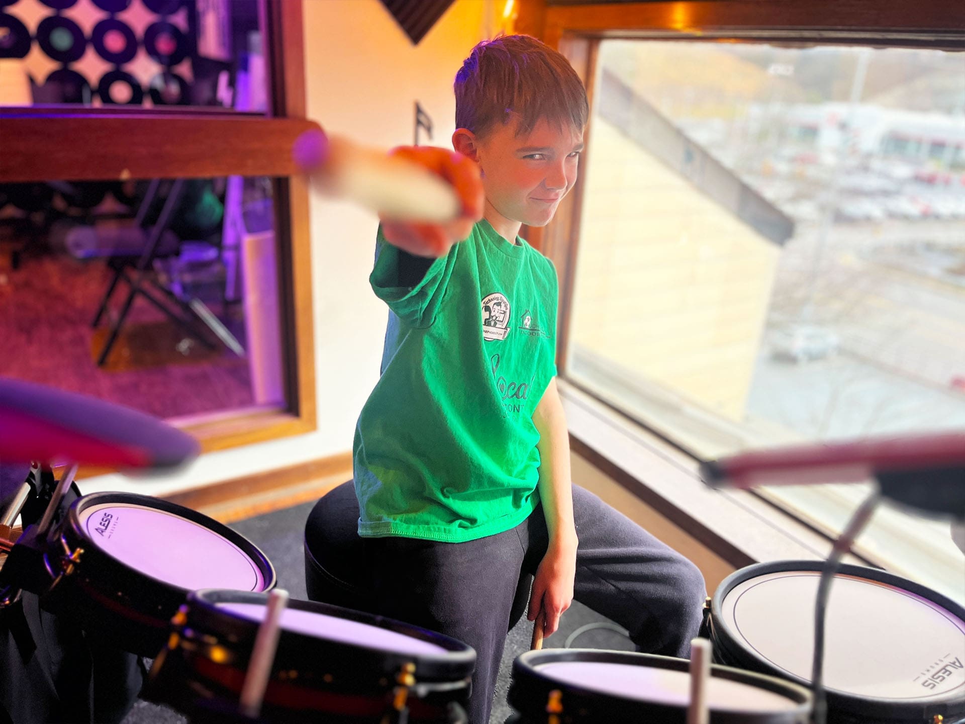 Young students playing musical instruments in group setting in Johnson City Tennessee at Freedom Music Academy